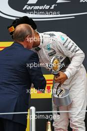 Race winner Lewis Hamilton (GBR) Mercedes AMG F1 celebrates on the podium with Vladimir Putin (RUS) Russian Federation President. 11.10.2015. Formula 1 World Championship, Rd 15, Russian Grand Prix, Sochi Autodrom, Sochi, Russia, Race Day.