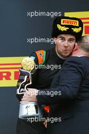 Sergio Perez (MEX) Sahara Force India F1 celebrates his third position on the podium. 11.10.2015. Formula 1 World Championship, Rd 15, Russian Grand Prix, Sochi Autodrom, Sochi, Russia, Race Day.