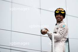 Race winner Lewis Hamilton (GBR) Mercedes AMG F1 celebrates on the podium. 11.10.2015. Formula 1 World Championship, Rd 15, Russian Grand Prix, Sochi Autodrom, Sochi, Russia, Race Day.