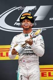 Race winner Lewis Hamilton (GBR) Mercedes AMG F1 celebrates on the podium. 11.10.2015. Formula 1 World Championship, Rd 15, Russian Grand Prix, Sochi Autodrom, Sochi, Russia, Race Day.