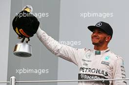 Race winner Lewis Hamilton (GBR) Mercedes AMG F1 celebrates on the podium. 11.10.2015. Formula 1 World Championship, Rd 15, Russian Grand Prix, Sochi Autodrom, Sochi, Russia, Race Day.