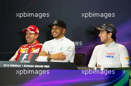 The post race FIA Press Conference (L to R): Sebastian Vettel (GER) Ferrari; Lewis Hamilton (GBR) Mercedes AMG F1; Sergio Perez (MEX) Sahara Force India F1. 11.10.2015. Formula 1 World Championship, Rd 15, Russian Grand Prix, Sochi Autodrom, Sochi, Russia, Race Day.