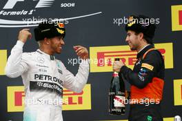 (L to R): Race winner Lewis Hamilton (GBR) Mercedes AMG F1 celebrates on the podium with third placed Sergio Perez (MEX) Sahara Force India F1. 11.10.2015. Formula 1 World Championship, Rd 15, Russian Grand Prix, Sochi Autodrom, Sochi, Russia, Race Day.