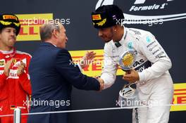 Race winner Lewis Hamilton (GBR) Mercedes AMG F1 celebrates on the podium with Vladimir Putin (RUS) Russian Federation President. 11.10.2015. Formula 1 World Championship, Rd 15, Russian Grand Prix, Sochi Autodrom, Sochi, Russia, Race Day.