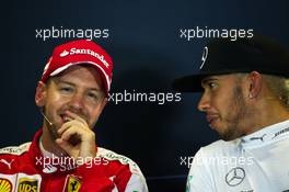 (L to R): Sebastian Vettel (GER) Ferrari and Lewis Hamilton (GBR) Mercedes AMG F1 in the FIA Press Conference. 11.10.2015. Formula 1 World Championship, Rd 15, Russian Grand Prix, Sochi Autodrom, Sochi, Russia, Race Day.