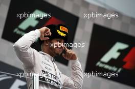 Race winner Lewis Hamilton (GBR) Mercedes AMG F1 celebrates on the podium. 11.10.2015. Formula 1 World Championship, Rd 15, Russian Grand Prix, Sochi Autodrom, Sochi, Russia, Race Day.