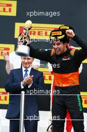 Sergio Perez (MEX) Sahara Force India F1 celebrates his third position on the podium. 11.10.2015. Formula 1 World Championship, Rd 15, Russian Grand Prix, Sochi Autodrom, Sochi, Russia, Race Day.