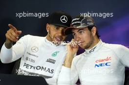 (L to R): Lewis Hamilton (GBR) Mercedes AMG F1 and Sergio Perez (MEX) Sahara Force India F1 in the FIA Press Conference. 11.10.2015. Formula 1 World Championship, Rd 15, Russian Grand Prix, Sochi Autodrom, Sochi, Russia, Race Day.