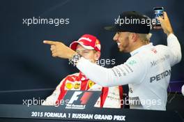 (L to R): Sebastian Vettel (GER) Ferrari and Lewis Hamilton (GBR) Mercedes AMG F1 in the FIA Press Conference. 11.10.2015. Formula 1 World Championship, Rd 15, Russian Grand Prix, Sochi Autodrom, Sochi, Russia, Race Day.