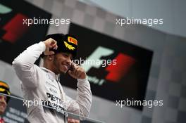 Race winner Lewis Hamilton (GBR) Mercedes AMG F1 celebrates on the podium. 11.10.2015. Formula 1 World Championship, Rd 15, Russian Grand Prix, Sochi Autodrom, Sochi, Russia, Race Day.