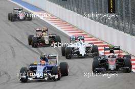 Felipe Nasr (BRA) Sauber C34 and Jenson Button (GBR) McLaren MP4-30. 11.10.2015. Formula 1 World Championship, Rd 15, Russian Grand Prix, Sochi Autodrom, Sochi, Russia, Race Day.