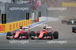 (L to R): Sebastian Vettel (GER) Ferrari SF15-T and team mate Kimi Raikkonen (FIN) Ferrari SF15-T battle for position. 11.10.2015. Formula 1 World Championship, Rd 15, Russian Grand Prix, Sochi Autodrom, Sochi, Russia, Race Day.