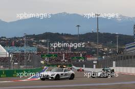 Lewis Hamilton (GBR) Mercedes AMG F1 W06 leads behind the FIA Safety Car. 11.10.2015. Formula 1 World Championship, Rd 15, Russian Grand Prix, Sochi Autodrom, Sochi, Russia, Race Day.