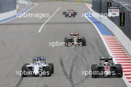 (L to R): Felipe Massa (BRA) Williams FW37 and Jenson Button (GBR) McLaren MP4-30 battle for position. 11.10.2015. Formula 1 World Championship, Rd 15, Russian Grand Prix, Sochi Autodrom, Sochi, Russia, Race Day.