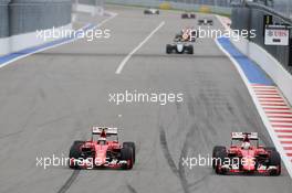 Kimi Raikkonen (FIN) Ferrari SF15-T and Sebastian Vettel (GER) Ferrari SF15-T battle for position. 11.10.2015. Formula 1 World Championship, Rd 15, Russian Grand Prix, Sochi Autodrom, Sochi, Russia, Race Day.