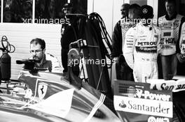 Lewis Hamilton (GBR) Mercedes AMG F1 looks at the Ferrari SF15-T of Sebastian Vettel (GER) Ferrari in parc ferme. 10.10.2015. Formula 1 World Championship, Rd 15, Russian Grand Prix, Sochi Autodrom, Sochi, Russia, Qualifying Day.