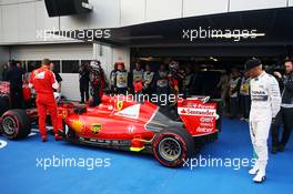 Lewis Hamilton (GBR) Mercedes AMG F1 W06 looks at the Ferrari SF15-T of Sebastian Vettel (GER) Ferrari in parc ferme. 10.10.2015. Formula 1 World Championship, Rd 15, Russian Grand Prix, Sochi Autodrom, Sochi, Russia, Qualifying Day.