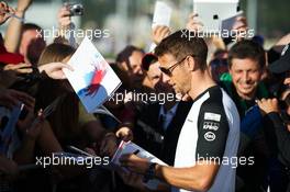 Jenson Button (GBR) McLaren signs autographs for the fans. 08.10.2015. Formula 1 World Championship, Rd 15, Russian Grand Prix, Sochi Autodrom, Sochi, Russia, Preparation Day.
