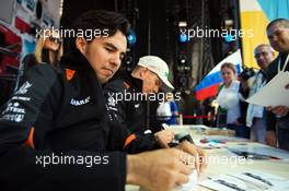 (L to R): Sergio Perez (MEX) Sahara Force India F1 and team mate Nico Hulkenberg (GER) Sahara Force India F1 sign autographs for the fans. 08.10.2015. Formula 1 World Championship, Rd 15, Russian Grand Prix, Sochi Autodrom, Sochi, Russia, Preparation Day.