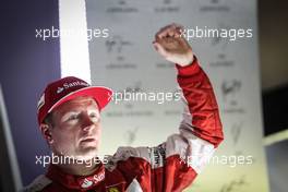 Kimi Raikkonen (FIN) Ferrari celebrates his third position on the podium. 20.09.2015. Formula 1 World Championship, Rd 13, Singapore Grand Prix, Singapore, Singapore, Race Day.