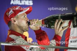 Race winner Sebastian Vettel (GER) Ferrari celebrates on the podium. 20.09.2015. Formula 1 World Championship, Rd 13, Singapore Grand Prix, Singapore, Singapore, Race Day.