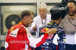 (L to R): Race winner Sebastian Vettel (GER) Ferrari celebrates in parc ferme with second placed Daniel Ricciardo (AUS) Red Bull Racing. 20.09.2015. Formula 1 World Championship, Rd 13, Singapore Grand Prix, Singapore, Singapore, Race Day.