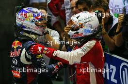 Race winner Sebastian Vettel (GER) Ferrari celebrates in parc ferme with second placed Daniel Ricciardo (AUS) Red Bull Racing (Left). 20.09.2015. Formula 1 World Championship, Rd 13, Singapore Grand Prix, Singapore, Singapore, Race Day.