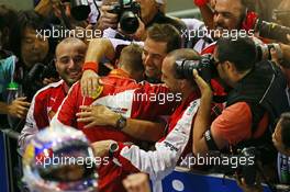 Race winner Sebastian Vettel (GER) Ferrari celebrates in parc ferme. 20.09.2015. Formula 1 World Championship, Rd 13, Singapore Grand Prix, Singapore, Singapore, Race Day.