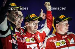 The podium (L to R): Daniel Ricciardo (AUS) Red Bull Racing, second; Sebastian Vettel (GER) Ferrari, race winner; Kimi Raikkonen (FIN) Ferrari, third. 20.09.2015. Formula 1 World Championship, Rd 13, Singapore Grand Prix, Singapore, Singapore, Race Day.