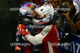 1st place Sebastian Vettel (GER) Ferrari with 2nd place Daniel Ricciardo (AUS) Red Bull Racing. 20.09.2015. Formula 1 World Championship, Rd 13, Singapore Grand Prix, Singapore, Singapore, Race Day.