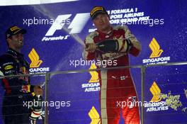 Kimi Raikkonen (FIN) Ferrari celebrates his third position on the podium. 20.09.2015. Formula 1 World Championship, Rd 13, Singapore Grand Prix, Singapore, Singapore, Race Day.