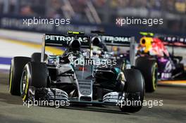 Nico Rosberg (GER) Mercedes AMG F1 W06 leads team mate Lewis Hamilton (GBR) Mercedes AMG F1 W06. 20.09.2015. Formula 1 World Championship, Rd 13, Singapore Grand Prix, Singapore, Singapore, Race Day.