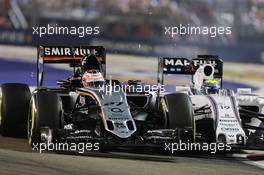 Nico Hulkenberg (GER) Sahara Force India F1 VJM08 and Felipe Massa (BRA) Williams FW37 crash during the race. 20.09.2015. Formula 1 World Championship, Rd 13, Singapore Grand Prix, Singapore, Singapore, Race Day.