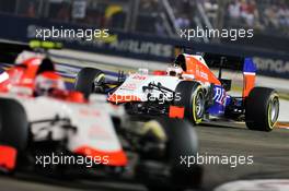 Will Stevens (GBR) Manor Marussia F1 Team follows team mate Alexander Rossi (USA) Manor Marussia F1 Team. 20.09.2015. Formula 1 World Championship, Rd 13, Singapore Grand Prix, Singapore, Singapore, Race Day.