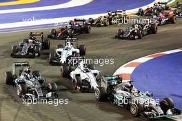 Lewis Hamilton (GBR) Mercedes AMG F1 W06, Nico Rosberg (GER) Mercedes AMG F1 W06 and Valtteri Bottas (FIN) Williams FW37 at the start of the race. 20.09.2015. Formula 1 World Championship, Rd 13, Singapore Grand Prix, Singapore, Singapore, Race Day.