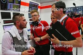 Will Stevens (GBR) Manor Marussia F1 Team with Gianluca Pisanello (ITA) Manor Marussia F1 Team Chief Engineer. 19.09.2015. Formula 1 World Championship, Rd 13, Singapore Grand Prix, Singapore, Singapore, Qualifying Day.