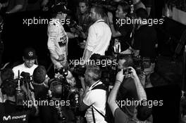 Lewis Hamilton (GBR) Mercedes AMG F1 and Nico Rosberg (GER) Mercedes AMG F1 with the media. 19.09.2015. Formula 1 World Championship, Rd 13, Singapore Grand Prix, Singapore, Singapore, Qualifying Day.