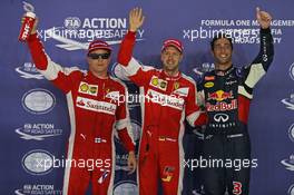 Qualifying top three in parc ferme (L to R): Kimi Raikkonen (FIN) Ferrari, third; Sebastian Vettel (GER) Ferrari, pole position; Daniel Ricciardo (AUS) Red Bull Racing, second. 19.09.2015. Formula 1 World Championship, Rd 13, Singapore Grand Prix, Singapore, Singapore, Qualifying Day.