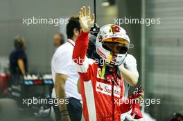 Sebastian Vettel (GER) Ferrari celebrates his pole position in parc ferme. 19.09.2015. Formula 1 World Championship, Rd 13, Singapore Grand Prix, Singapore, Singapore, Qualifying Day.