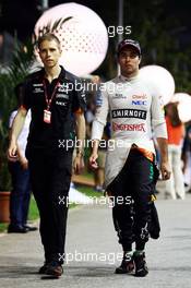 Sergio Perez (MEX) Sahara Force India F1 with Will Hings (GBR) Sahara Force India F1 Press Officer. 19.09.2015. Formula 1 World Championship, Rd 13, Singapore Grand Prix, Singapore, Singapore, Qualifying Day.