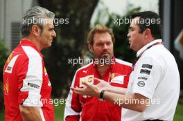 (L to R): Maurizio Arrivabene (ITA) Ferrari Team Principal with Gino Rosato (CDN) Ferrari and Eric Boullier (FRA) McLaren Racing Director. 17.09.2015. Formula 1 World Championship, Rd 13, Singapore Grand Prix, Singapore, Singapore, Preparation Day.