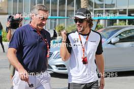 (L to R): Carlos Sainz (ESP) with Fernando Alonso (ESP) McLaren. 27.11.2015. Formula 1 World Championship, Rd 19, Abu Dhabi Grand Prix, Yas Marina Circuit, Abu Dhabi, Practice Day.