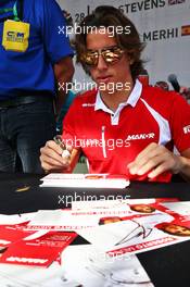 Roberto Merhi (ESP) Manor Marussia F1 Team signs autographs for the fans. 27.11.2015. Formula 1 World Championship, Rd 19, Abu Dhabi Grand Prix, Yas Marina Circuit, Abu Dhabi, Practice Day.