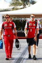 Sebastian Vettel (GER) Ferrari with Antti Kontsas (FIN) Personal Trainer. 27.11.2015. Formula 1 World Championship, Rd 19, Abu Dhabi Grand Prix, Yas Marina Circuit, Abu Dhabi, Practice Day.