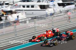 Max Verstappen (NLD) Scuderia Toro Rosso STR10 and Sebastian Vettel (GER) Ferrari SF15-T. 27.11.2015. Formula 1 World Championship, Rd 19, Abu Dhabi Grand Prix, Yas Marina Circuit, Abu Dhabi, Practice Day.