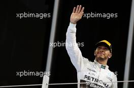 Lewis Hamilton (GBR) Mercedes AMG F1 celebrates his second position on the podium. 29.11.2015. Formula 1 World Championship, Rd 19, Abu Dhabi Grand Prix, Yas Marina Circuit, Abu Dhabi, Race Day.