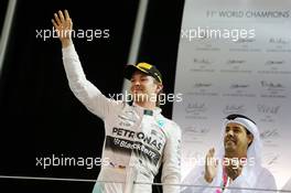 Race winner Nico Rosberg (GER) Mercedes AMG F1 celebrates on the podium. 29.11.2015. Formula 1 World Championship, Rd 19, Abu Dhabi Grand Prix, Yas Marina Circuit, Abu Dhabi, Race Day.