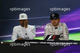 (L to R): Lewis Hamilton (GBR) Mercedes AMG F1 and team mate Nico Rosberg (GER) Mercedes AMG F1 in the FIA Press Conference. 29.11.2015. Formula 1 World Championship, Rd 19, Abu Dhabi Grand Prix, Yas Marina Circuit, Abu Dhabi, Race Day.