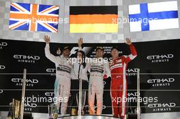 The podium (L to R): Lewis Hamilton (GBR) Mercedes AMG F1, second; Nico Rosberg (GER) Mercedes AMG F1, race winner; Kimi Raikkonen (FIN) Ferrari, third. 29.11.2015. Formula 1 World Championship, Rd 19, Abu Dhabi Grand Prix, Yas Marina Circuit, Abu Dhabi, Race Day.