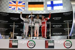 The podium (L to R): Lewis Hamilton (GBR) Mercedes AMG F1, second; Nico Rosberg (GER) Mercedes AMG F1, race winner; Kimi Raikkonen (FIN) Ferrari, third. 29.11.2015. Formula 1 World Championship, Rd 19, Abu Dhabi Grand Prix, Yas Marina Circuit, Abu Dhabi, Race Day.